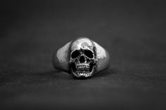 Classic Infinity Ring Symbolic Engraved Skull Ring, Classic Sterling Silver Skull Jewelry, Classic Polished Skull Ring Collectible, Sterling Silver Skull Ring Collectible, Hand Cast Sterling Silver Skull Ring, Collectible Sterling Silver Skull Ring, Classic Skull Ring As Gift, Sterling Silver Skull Ring Engraved, Sterling Silver Skull Ring With Engraving