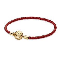 From Pandora, add a little edge to your look with this woven bracelet in red leather with clasp detail in Pandora Shine, an 18k gold-plated unique metal blend. Wear your favourite Pandora charms a little differently by stringing them on a red leather bracelet, perfect for those wishing to stand out from the crowd. The leather finish lends a distinctive, modern look and allows you to play with form by layering multiple bracelets or charms or wearing alone as a statement piece. Bracelet measures 7 Elegant Leather Bracelets With Gold Clasp, Elegant Leather Bracelet With Gold Clasp, Yellow Gold Leather Bracelet Gift, Yellow Gold Leather Bracelet As Gift, Elegant Leather Jewelry With Gold Clasp, Yellow Gold Leather Bracelets For Gift, Elegant Braided Leather Bracelets, Elegant Braided Leather Bracelet, Classic Yellow Gold Leather Bracelet