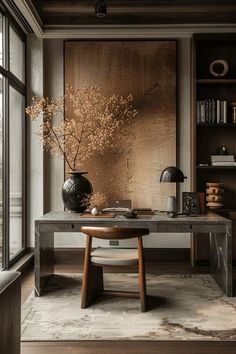 a room with a table, chair and vase on the floor in front of a window