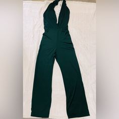 Dark Green Jumpsuit Dark Green Size Medium Open Neckline And Back. Brand New Zara Green V-neck Jumpsuits And Rompers, Green Stretch Halter Neck Jumpsuits And Rompers, Green Stretch Halter Neck Jumpsuit, Green Halter Neck Jumpsuit With Stretch, Zara Strapless Sleeveless Jumpsuit For Party, Casual Green Zara Jumpsuits And Rompers, Green Stretch Bodysuit By Zara, Spring Stretch Jumpsuits And Rompers By Zara, Elegant Zara Jumpsuits And Rompers