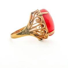 Vintage Coral Art Deco Style Cocktail Estate 14K yellow gold ring with a captivating coral gemstone. It combines vintage charm with Art Deco style, making it a stunning choice for special occasions.14K Yellow Gold Red Coral 14tcw ( 17.3mm x 12.2mm )Size 6.5 Resize available Thank you for visiting our shop!Visit our website DmKJewelry.comAlso Follow us on Instagram https://www.instagram.com/dmkjewelryny/ Elegant Red Intaglio Signet Ring, Red Intaglio Rings For Anniversary, Vintage Yellow Gold Carnelian Ring, Vintage Carnelian Yellow Gold Ring, Vintage Carnelian Ring For Formal Occasions, Elegant Round Carnelian Signet Ring, Elegant Carnelian Rings For Wedding, Elegant Gold Signet Ring With Carnelian, Elegant Yellow Gold Carnelian Ring