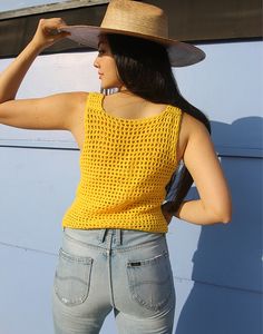 Vintage crochet tank top in yellow. Sleeveless. Scoop neckline. Size S, UK 6-10 / EU 34-38. Measurements- 34"(86cm) bust - 20"(51cm) top length. Material- Wool Condition - Excellent. Care - Handwash Cold Handpicked, repaired and ready to wear. This is an original vintage item, not new and minor signs of wear & age are expected, we will highlight any major flaws.Model is a UK 6/8 and is 5'7" tall Yellow Camisole Crop Top For Summer, Casual Crochet Sleeveless Tank Top, Stretch Sleeveless Crochet Top For Summer, Sleeveless Stretch Crochet Top For Summer, Summer Crochet Sleeveless Tank Top, Casual Crochet Sleeveless Top, Sleeveless Crochet Tank Top For Summer, Fitted Yellow Crochet Top For Summer, Yellow Cotton Summer Vest