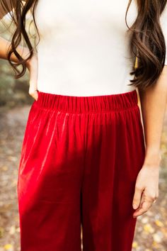 the perfect start to a fun, luxe outfit- these pants are a must have for all your holiday and valentine events! elastic waist, wide leg, in the prettiest red velvet. model is wearing a size small. size small measurements: waist- 25", inseam- 31" size 1X measurements: waist- 33" inseam- 30" Red Wide-leg Pants With Elastic Waistband, Casual Red Bottoms For Holidays, Casual Red Holiday Bottoms, Red Wide Leg Pants With Elastic Waistband, Red Stretch Wide Leg Pants With Elastic Waistband, Holiday Stretch Wide Leg Bottoms, Red Long Pants For Holiday, Holiday Red Long Pants, Red Holiday Long Pants