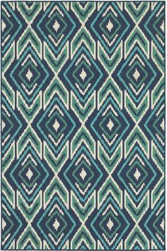 a blue and green rug with an abstract design