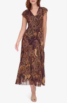 Swirling paisley lends bohemian charm to this maxi dress that's cut with a hint of stretch to offer lasting comfort. 55" length (size 4) Slips on over head V-neck
 Short sleeves Lined 95% polyester, 5% spandex Dry clean Imported Flowy Maxi Dress With Paisley Print, Flowy Paisley Print Maxi Dress, Casual Fitted Maxi Dress With Paisley Print, Fitted Paisley Print Maxi Dress With V-neck, Fitted Boho Print Maxi Dress, Casual Flowy Paisley Print Maxi Dress, Casual Flowy Maxi Dress With Paisley Print, Elegant Boho Print Maxi Dress, Elegant Fitted Maxi Dress With Paisley Print