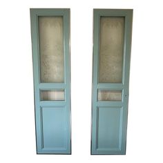 two blue doors with frosted glass on the top and bottom, side by side