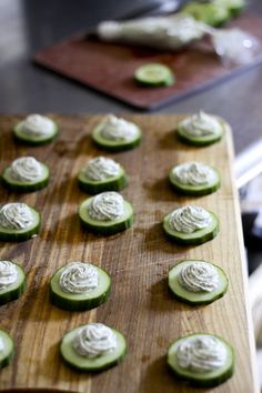 cucumbers are arranged on a cutting board ready to be baked in the oven