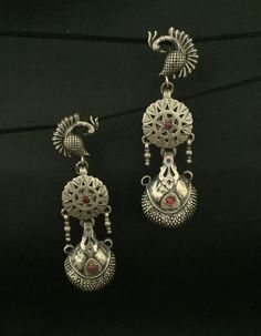 Handmade item (Earring-Jhumki) Materials:  Silver  Style: Traditional Description:-  Antique silver 925, 18K Gold Plated, Gemstone Engagement , Anniversary , Honeymoon, First Date for Women, Traditional Earring - Jhumki , Gift for Her Metal :- SOLID 925 sterling silver  Weight- 35 grams apx ( Earrings are same as shown in the pictures. We have only one piece in this style and colour, hence you get what you see in the picture ) Package - Individual gift wrapped box How to care:- The sterling material itself is soft, this ring band is thin, please avoid any serious collision and squeezing, because this may make the ring bent or stone fall out, we recommend you to buy a larger half size ring to make finger loose, this will avoid any squeezing. Handmade Jewelry By Vidita Jewels Contact us if a Earrings Handmade Silver, Handmade Silver Earrings, Traditional Earrings, Earrings Antique, Silver Earrings Handmade, Peacock Design, Gemstone Engagement, Silver Style, Silver Stud Earrings