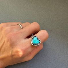 "ArtisanLab Jewelry Kingman Turquoise Mini Heart Stacking Ring Material: Sterling silver +Kingman Turquoise ♥Ready to ship: Size -US5.5 ♥Made to order- 7 days to make (Please leave your ring size on \"Note\" at checkout) ♥Email (artisanlabjewelry@gmail.com) or DM (instagram: artisanlab) me if you want to choose your stones ♥ Made in my home studio from Austin Texas, using time-consuming, traditional metalsmithing techniques. This piece is made with solid craftsmanship and all parts of this piece have been hand-fabricated. ♥ All of the pieces in my collections are handmade and hand-finished." Handmade Blue Heart Ring, Handmade Blue Heart Shaped Ring, Heart-shaped Turquoise Ring, Handmade Blue Heart Ring Gift, Handmade Blue Heart Ring For Gift, Heart-shaped Turquoise Ring For Anniversary, Heart-shaped Blue Turquoise Ring Gift, Heart-shaped Blue Turquoise Ring For Gift, Heart-shaped Turquoise Blue Ring For Gift