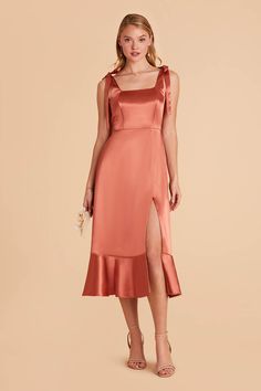 A convertible pinafore-style midi bridesmaid dress is a gorgeous addition to your cottagecore or garden wedding affair. This versatile, convertible midi is lovely, from its square neckline top to its romantic ruffled bottom. But this satin gown sweetest touch might be the removable bows at its straps | Terracotta Bridesmaid Dress Shiny Satin Size 2X | Birdy Grey Eugenia Convertible Midi Terracotta Bridesmaid Dress, Terracotta Bridesmaid, Bridal Shower Treats, Midi Bridesmaid Dress, Wedding Roles, Tuxedo Women, Birdy Grey, Satin Gown, Plus Size Jumpsuit