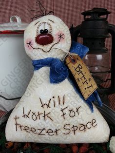 a snowman with a tag on it's neck and the words will work for freezer space