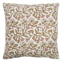 a brown and white pillow with pink flowers on it's side, against a white background