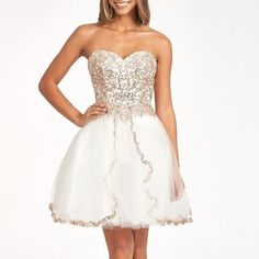 Glitter And Sequin Embellished Bodice Sweetheart Mesh Homecoming Dress For The Most Cutest Girl In The World! This Sequin Embellished Mesh Short Dress Is Decorated With Sparkly Glitter In Splendid Pattern. Strapless Sweetheart Neckline Add Romantic Touch, And Wide Open Lace-Up Back Offers Chic Vibe To Your Look. Color Off White Fabric: Mesh Length: Short Neckline: Sweetheart Sleeve: Strapless Back: Corset, Lace Up Embellishment: Glitter, Sequin Silhouette: Babydoll Sweetheart Homecoming Dress, Glitter Shorts, Mesh Short, Strapless Sweetheart Neckline, Corset Lace, White Glitter, Homecoming Dress, White Fabric, White Fabrics