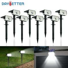 six solar powered garden lights on the side of a house and in front of a garage