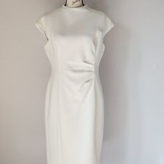 Lauren Ralph Lauren Side Ruched Texture Sheath Dress Cap Sleeve High Neck Lined Stretch White Polyester Blend Condition Is Pre-Owned In Excellent Condition. Please Note: *The Real Color Of The Item May Be Slightly Different From The Pictures Shown On Website Caused By Many Factors. *Don't Go By Size Number. Do Check Measurements To Determine If The Item Will Fit. Measurements: Approximately (Laying Flat). -Shoulder To Shoulder: 20 Inches (Shoulder Seam To Shoulder Seam) -Armpit To Armpit: 20 Inc White Ruched Dresses For Work, White Ruched Dress For Office Wear, White Ruched Dress For Work, Classic Fitted Dress With Cap Sleeves, Cream Fitted Dress With Pleated Waist, Classic Fitted Ruched Dress, Cream Dresses With Pleated Waist And Fitted Design, Elegant Dresses With Pleated Waist And Cap Sleeves, Elegant White Cap Sleeve Dress