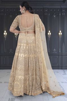 This exquisite bridal lehenga is a perfect blend of tradition and elegance, designed to make any bride feel like royalty on her special day. The ensemble features a lehenga adorned with intricate gold embroidery including sequin, stonework, and zardozi embellishments, set against a gold base. Completing the look is a net dupatta with matching embroidery along its borders. WASH CARE INSTRUCTIONS - Please Dry clean only when it is applicable! Ready to Ship! Matching Embroidery, Gold Lehenga, Zardozi Embroidery, Net Dupatta, Gold Embroidery, Bridal Lehenga, Lehenga, Special Day, Feel Like