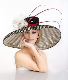 2019 spring collection. Large oversized off white hat covered with black mesh material . Adorned with hand made feather flower and quills. One of the kind. Was featured on a few news channels and runway shows. Limited edition Luxury Straw Hat For Formal Kentucky Derby, Luxury Pinched Crown Hats For Races, Luxury Vintage Top Hat For Kentucky Derby, Luxury Straw Hat For Kentucky Derby And Church, Luxury Classic Costume Hats With Curved Brim, Luxury Hats With Pinched Crown For Events, Luxury Flat Crown Top Hat For Kentucky Derby, Luxury Ostrich Feather Hats For Spring, Luxury Curved Brim Costume Hat With Feathers