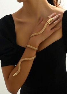 🌟 PRODUCT DETAILS: ✅ Crafted to captivate, our Bendable Snake Bracelet is a mesmerizing piece of serpent jewelry that exudes mystery and elegance. This adjustable gold snake bracelet is not just an accessory; it's a statement of bold style and allure. ❗️Key Features: ⚡️Unique Design: Embrace the mystique of the serpent with our Bendable Snake Bracelet. This stunning piece features a lifelike snake design that coils around your wrist, creating a striking and adjustable arm cuff. ⚡️Quality Materi Snake Arm Cuff, Serpent Jewelry, Finger Hands, Hand Chain Bracelet, Arm Jewelry, Arm Bracelets, Snake Bracelet, Snake Design, Gold Collar