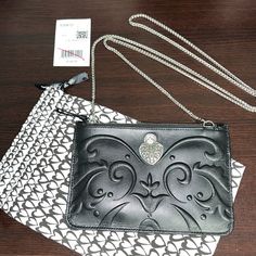 Brighton Cordoba Mini Cross Body Envelope Style Bag. Black Smooth Grained Leather, With Silver Chain Strap That Is Removable. 1 Exterior Pocket On The Back, 1 Interior Slip Pocket, 2 Interior Credit Card Slots. 8”X5.5” Brand New With Tag, Never Used. Stored In Dust Bag Which Is Included. Formal Crossbody Shoulder Bag With Zipper, Elegant Black Pouch With Cell Phone Pocket, Black Crossbody Clutch With Zipper Pouch, Designer Black Bag With Zipper Pouch, Black Zippered Crossbody Clutch, Elegant Shoulder Bag Pouch With Cell Phone Pocket, Elegant Crossbody Pouch With Cell Phone Pocket, Elegant Black Bag With Zipper Pouch, Formal Black Shoulder Bag With Zipper Pouch