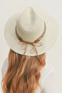 Add a touch of boho charm to your look with this stylish Straw Panama Fedora Hat! Quality crafted and accented with a Boho embroidered band, this hat is the perfect way to stay looking cool and on-trend. Plus, the suede tie accent gives it a unique touch! Material: 100% paper straw Circumference: 22" Brim length: 3.25" Adjustable Flat Brim Braided Fedora, Adjustable Fedora With Braided Detail And Flat Brim, Adjustable Braided Fedora With Flat Brim, Adjustable Braided Fedora, Adjustable Braided Fedora Hat, Western Style Cream Panama Hat, Casual Braided Boater Hat, Casual White Hat Band For Beach, Casual Adjustable Braided Boater Hat