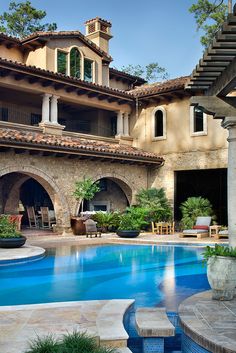 an outdoor swimming pool with steps leading to it