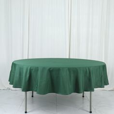 a round table with a green cloth on it