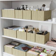 the shelves are filled with makeup and personal care items in storage boxes on top of each other