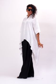 Easy and breezy, the Unstoppable Oversized linen shirt women features an asymmetrical construction, with a cut to adjust the length of the back, relaxed sleeves and front button closure. With pants, this White linen half sleeve shirt makes Monday mornings bearable. The White asymmetrical shirt is designed to be comfortable and not troublesome to wear. After wearing this Oversized linen shirt women, you will love it even more. The White half sleeve womens linen top is made of high quality linen f Oversized Asymmetrical Summer Blouse, Asymmetrical Summer Blouse With Relaxed Fit, Oversized Shirt With Asymmetrical Hem, Relaxed Fit Linen Blouse With Shirttail Hem, Relaxed Fit Shirt With Asymmetrical Hem For Summer, Summer Shirt With Relaxed Fit And Asymmetrical Hem, Summer Blouse With Relaxed Fit And Asymmetrical Hem, Summer Cotton Lagenlook Shirt, Oversized Summer Shirt With Asymmetrical Hem