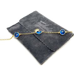 MELIGreece's memoir from the Greek islands, a 14k solid gold chain bracelet with three semi-transparent eye charms in a celestial blue color. Wearing a jewelry with an evil eye protects you from the negative energy around you. An easy to wear precious gold bracelet can be easily combined with your watch or your other bracelets. Yellow gold bracelet with three eye lucky charms in bright blue color with white and black enamel details, made in our workshop in Athens, Greece. Length of the bracelet: Luxury Bracelets With Delicate Chain, Dainty Blue Chain Jewelry, Elegant Yellow Gold Evil Eye Bracelet Gift, Luxury Delicate Chain Bracelet Gift, Elegant Round Chain Bracelet With Evil Eye, Elegant Evil Eye Bracelet With Adjustable Chain Gift, Elegant Round Evil Eye Chain Bracelet, Fine Jewelry Adjustable Chain Bracelet As Gift, Elegant Blue Bracelet With Delicate Chain