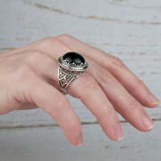 Black Onyx 925 Sterling Silver Ring Artisan Made Handcrafted Filigree Art Dome Ring Gift for Her Ring Face Length is 0.80 inches and Width is 0.80 inches Black Onyx Gemstone is 16 mm round cabochon cut. This metal embroidery filigree ring is oxidized and highly polished. Comes with velvet pouch and luxurious gift box. Filigree is made of delicate metal strands that have been skillfully fashioned to create an outstanding combination of old and modern art. Originating in Mesopotamia, Anatolia. It Black Oval Filigree Jewelry, Oval Black Filigree Jewelry, Elegant Handmade Silver Dome Ring, Black Filigree Ring Jewelry, Black Filigree Ring With Intricate Design For Formal Occasions, Black Oval Ring With Intricate Design, Black Dome Ring With Polished Finish As Gift, Black Filigree Ring, Black Oval Rings With Intricate Design