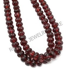 three strands of red glass beads