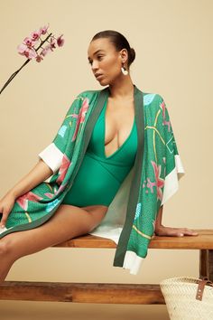 Elegant and striking, our Dhana Kimono is the perfect layer for summer days and effortless style. Throw it over a dress, jeans, or even a swimsuit, wear it on a night out, at the beach, or in the comfort of your home. The print on our Kimono is inspired by traditional Kanga textiles and is digitally printed. Made from 100% Rayon, a natural fibre, this Kimono is One Size and it is made in South Africa. We collaborated with a few local brands based in South Africa to create these special looks: Qi Printed Summer Cover-up For Day Out, Summer Tropical Print Poolside Cover-up, Chic Spring Unlined Cover-up, Chic Unlined Spring Cover-up, Summer Beach Cover-up Kimono, Chic V-neck Summer Kimono, Spring Tropical Print Cover-up For Poolside, Printed Summer Poolside Cover-up, Chic Swimwear For Vacation During Resort Season