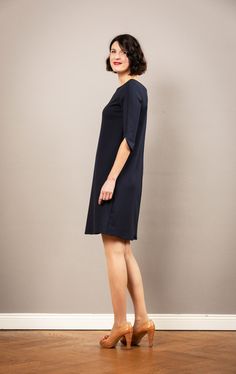 Charlotta is a fine, simple dress in a flared A-line, in dark blue. Particularly elegant is the simple, neck-free neckline, which also gives a small view of the back. Charlotta's highlight is the straight, two-piece sleeve, which ends with an elegant bow edge. Chalotta doesn't constrict you, is uncomplicated and conjures up a great figure. Also wonderful to go out, as a dress for the registry office and as a dress for wedding guests. The dress is available in sizes 36-44. We also make the dress Elegant Navy A-line Dress, Classic Navy A-line Dress, Navy A-line Dress For Work, Dress For Wedding, Simple Dress, Wedding Guests, The Conjuring, Simple Dresses, Wedding Guest Dress