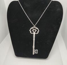 Large key necklace silver in colour detailed key surround, stylish and comfortable ,would make the perfect new home gift lovely piece of jewellery for your friends and loves ones . Check out my store Here: https://craftingbymoonlight1.etsy.com More Necklace Here: https://www.etsy.com/your/shops/me/tools/listings/section:50199451 International Shipping & Delivery Policy Thank you for your order! We take great care in packing and shipping each item to ensure it arrives safely. Here are the importa Elegant Sterling Silver Key Jewelry, Silver Key Pendant Jewelry, Elegant Sterling Silver Key Necklace, Silver Pendant Necklace With Two Keys, Elegant Key Pendant Necklace, Silver Key Pendant Necklace, Silver Key Necklace For Gift, Elegant Two Keys Necklace Gift, Elegant Two Keys Necklace As Gift