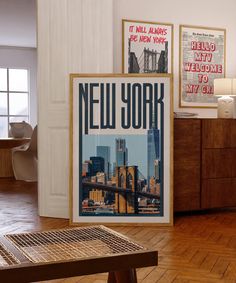 there is a new york poster on the wall next to a wooden table in this room