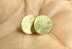 This listing is for a pair of 10 mm, large, handmade, round,  hammered  18k solid gold studs. - Seen here in matte finish. - The posts are made of 14k gold. - Close with silicon nuts. Size : 10 mm across. MADE TO ORDER. Ships in a gift box. (Please contact me with any questions or requests : ) Luxury Hammered Round Earrings, Luxury Round Hammered Earrings, Hammered Yellow Gold Circular Earrings, Yellow Gold Hammered Circle Earrings, Hammered Earrings For Anniversary, Round Earrings With Polished Finish For Gift, Handmade Yellow Gold Circle Earrings, 14k Gold Round Earrings, Yellow Gold Circle Earrings For Anniversary