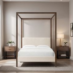 a white bed sitting in a bedroom next to two nightstands