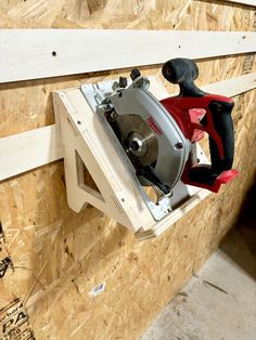 a circular saw is mounted to the side of a wall