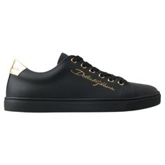 Step Into Luxury With These Stunning, Brand New Classic Sneakers From The Iconic Fashion House Dolce & Gabbana. Crafted From Premium 100% Leather In A Sleek Black With Gold Accents, These Shoes Are Not Just A Statement Of Style, But A Testament To Italian Craftsmanship. The Durable Rubber Sole Ensures Comfort And Longevity, While The Distinctive Logo Detail Adds An Exclusive Touch To Your Every Step. Elegance Meets Street Style With These Luxurious Sneakers, Made In Italy. Material: 100% Leather Luxury Leather Sneakers With Metallic Logo, Luxury Sneakers With Laces, Luxury Calf Leather Sneakers For Formal Occasions, Elegant Black Round Toe Sneakers, Leather Low-top Sneakers For Evening, Evening Leather Low-top Sneakers, Luxury Gold Sneakers With Rubber Sole, Luxury Calf Leather Sneakers, Gold Luxury Sneakers With Metallic Logo