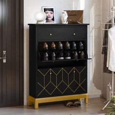 a black and gold shoe rack with shoes on it