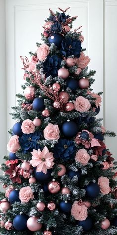 Bring the holiday spirit to your home with these stunning Christmas tree ideas! Discover unique decorating styles that suit every theme, from rustic charm to modern elegance. #ChristmasDecor #TreeInspiration #HolidayDecor #FestiveIdeas #XmasDecor Pink And Navy Blue Christmas Tree, Pink And Blue Christmas Tree Decorations, Navy Blue And Pink Christmas Tree, Pink And Blue Christmas Decorations, Pink And Blue Christmas Tree, Navy Blue Christmas Decor, Navy Blue Christmas Tree, Navy Christmas Tree, Pink And Blue Christmas