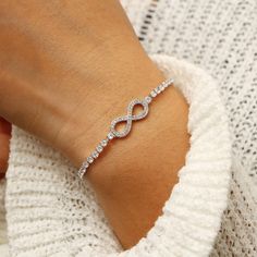 Infinity Tennis Bracelet - Limitless Jewellery Classic Infinity Bracelets For Anniversary, Classic Adjustable Infinity Jewelry, Minimalist Infinity Bracelet, Elegant Infinity Cubic Zirconia Jewelry, Adjustable Infinity Bracelet For Formal Occasions, Elegant Infinity Bracelets For Wedding, Infinity Jubilee Bracelet For Anniversary, Elegant Wedding Infinity Bracelets, Cubic Zirconia Infinity Bracelet For Wedding