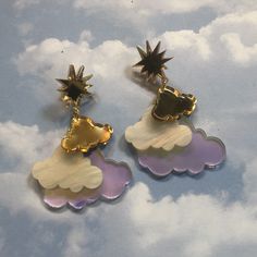 "Maybe you think that clouds are sad but I think that these earrings are oh-so-sweet. Put them on and consider yourself a force of nature. I designed the pendants on my computer and laser cut them from acrylic. I used 1/8\" opaque, iridescent, and mirrored acrylic. Cloud measures about 2\" wide by 3.25\" long These hang from gold studs. If you prefer wrap around hooks (that work for plugs) no problem- just drop me a line in the notes to seller section! Have you seen the matching plane necklace, Plane Necklace, Cloud Earrings, Color Cloud, Dinosaur Earrings, Mirrored Acrylic, Force Of Nature, A Force, Laser Cut Acrylic, Lasercut Design