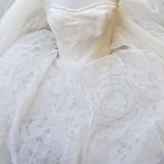 a white wedding dress on display in a store