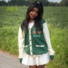 Show your Hawkins High School Pride by getting into uniform with our cozy knit cardigan featuring embroidered chenille patches. Go Tigers! 100% Acrylic Oversized Unisex Fit Embroidered Chenille Patches Stranger Things x Cakeworthy Licensed Product. Model Sizes: Male Model: Medium Female Model: Small Collegiate Cotton Long Sleeve Cardigan, Collegiate Long Sleeve Cotton Cardigan, Casual Winter Cardigan For College, Casual White Embroidered Cardigan, Collegiate Long Sleeve Cardigan For College, Winter College Cardigan, Long Sleeve Collegiate Cardigan For College, White Fall Sweater For College, White Winter Sweater For School