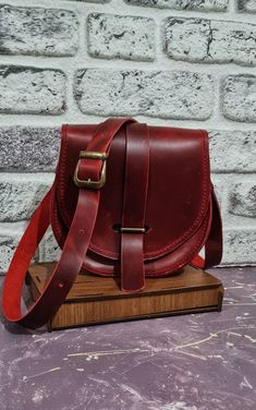 Formal Red Satchel Saddle Bag, Formal Red Saddle Bag Satchel, Burgundy Leather Crossbody Shoulder Bag, Burgundy Leather Lining Crossbody Shoulder Bag, Burgundy Leather-lined Crossbody Shoulder Bag, Red Leather Saddle Bag For Formal Occasions, Red Leather Saddle Bag For Formal Events, Burgundy Leather Crossbody Flap Bag, Burgundy Satchel Shoulder Bag With Leather Lining