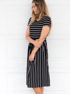 Looking for a dress that's both stylish and comfortable? Look no further than our Striped Midi Dress! With its classic stripes and midi-length, this dress is perfect for any occasion. Whether you're running errands or going out for a night on the town, this dress has got you covered. Pair it with a jean jacket and sneakers for a casual look, or dress it up with some great jewelry and heels for a more formal affair. Size: Small 0-4 Medium 6-8 Large 10-12 XL 12-14 Casual Striped Maxi Dress For Spring, Striped Casual Maxi Dress For Day Out, Striped Maxi Dress For A Casual Day Out, Casual Striped Maxi Dress For Day Out, Casual Striped Knee-length Dress, Black Summer Dress With Striped Hem, Casual Striped Knee-length Midi Dress, Casual Spring Dress With Vertical Stripes, Casual Striped Dresses For Day Out