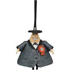 an ornament shaped like a man wearing a top hat and coat