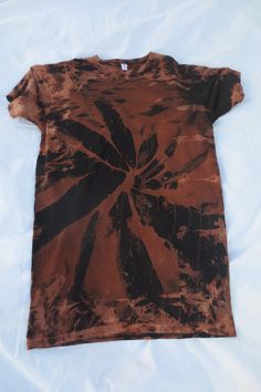 Here's a Hanes O/S acid washed t-shirt dress. The t-shirt dress was acid washed to remove some of the pigmentation from the shirt. Then the shirt was dye. with some brown dye Then the shirt was  washed to remove any smells of dyes or bleach and then it was hanged dried. The shirt is in good condition. But there's a tear on one sleeves. There's some crackling on the image. But it adds character to the shirt.     Material -  100% Cotton Pit to Pit - About 21 inches  Top to Bottom - About 36 inches Satin Jackets, Hanging Dryer, Acid Wash, Dress Clothes For Women, T Shirt Dress, Cool Style, Bleach, Shirt Dress, Dress Outfits