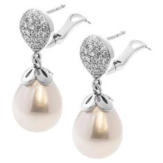 Pearls and Diamonds Drop Earring For Sale at 1stDibs Luxury Pear-shaped Diamond Earrings For Evening, Luxury Diamond Earrings With Pearl Drop, Luxury Pear-shaped Diamond White Diamond Earrings, Luxury Pear-shaped Diamond White Earrings, Luxury Pear-shaped Earrings With Diamond Accents, Luxury Diamond White Diamond Earrings With Pearl Drop, Pear-shaped Diamond Earrings With Accents For Evening, Luxury Pear-shaped Earrings With Pave Setting, Formal Pear-shaped Earrings With Pave Setting